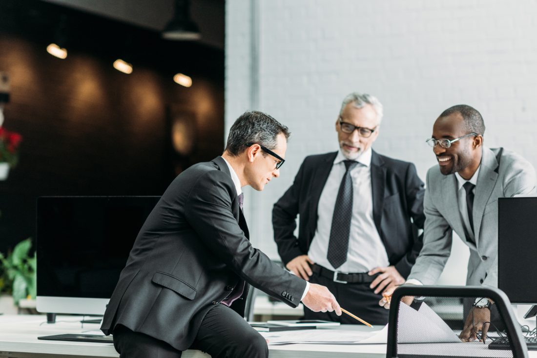 Multiethnic Businessmen Discussing New Business Strategy On Meet