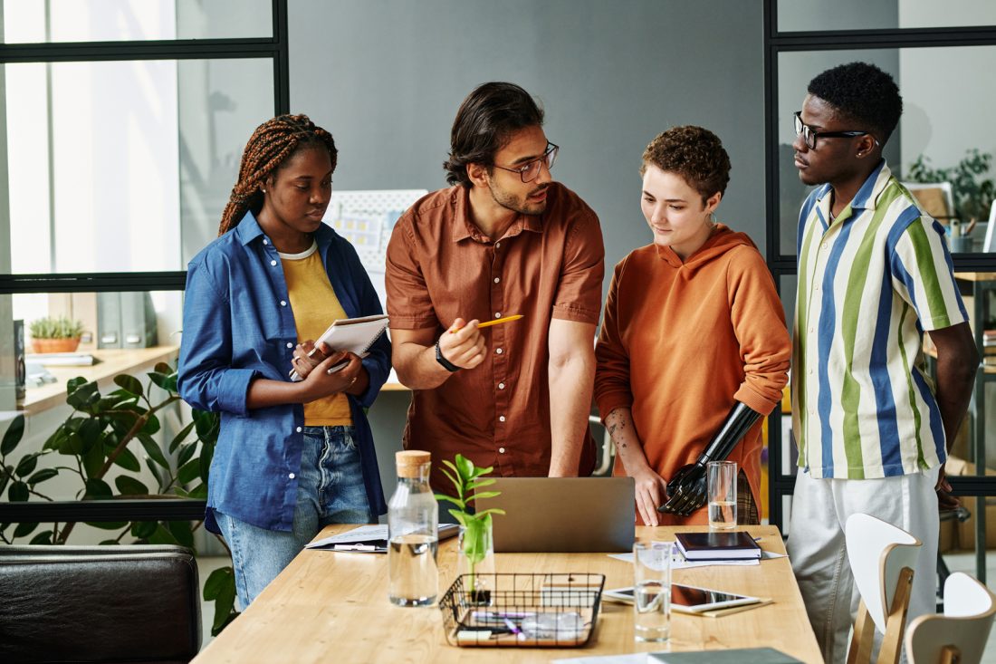 Young Designer Pointing Out His Opinion To Colleagues